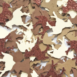 Horse confetti by EneloJoleneDesigns on Etsy. It shows brown, tan, white, light brown, and brown glitter paper cutouts of horses scattered.