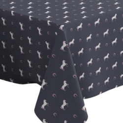 A horse print tablecloth from Letsstartwith1 on Etsy. It is a navy tablecloth with white horses with pink manes and tails and pink horseshoes.