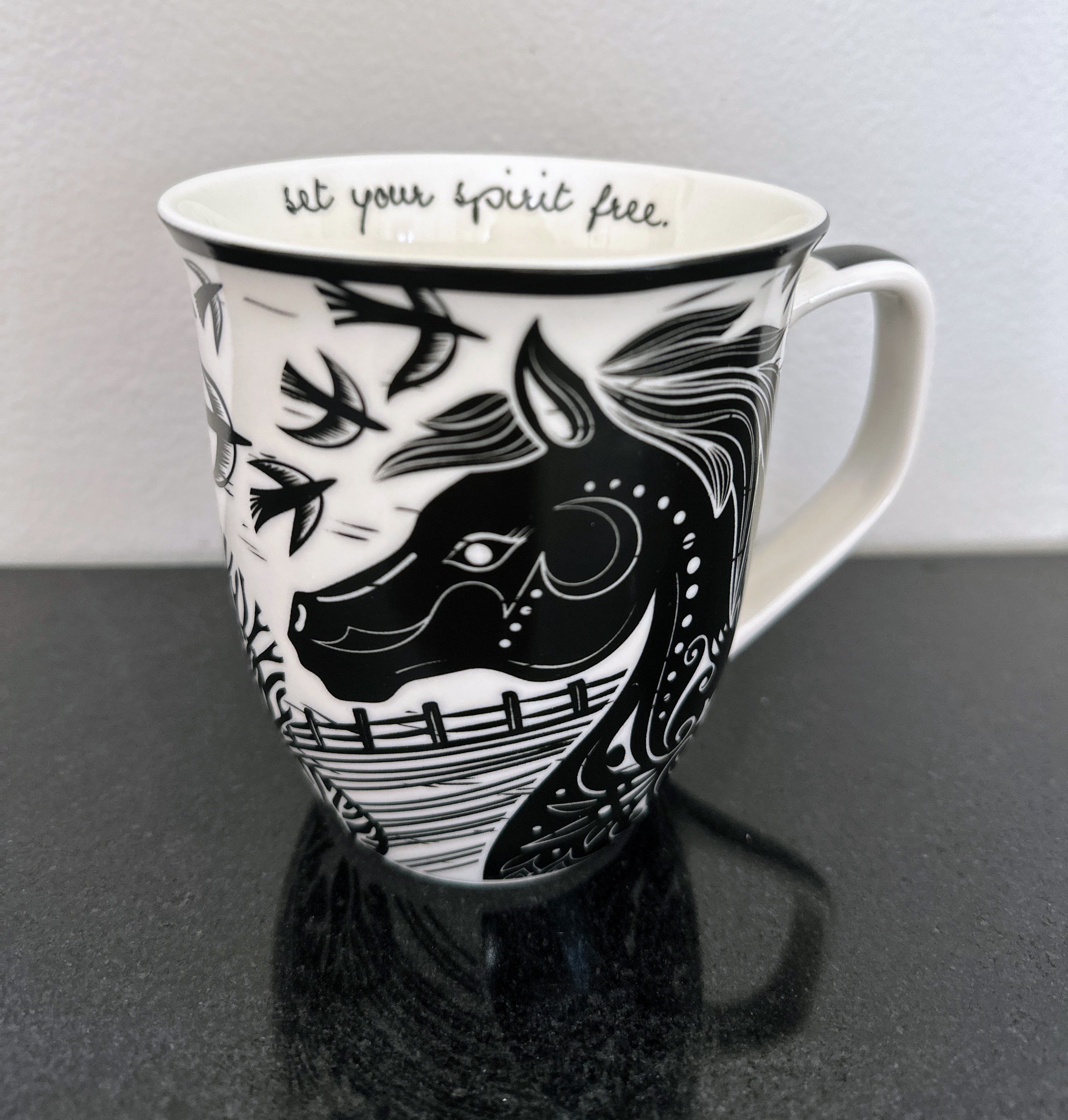 photo of black and white horse mug