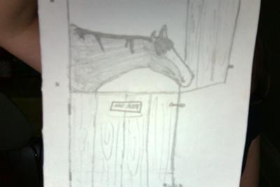 A pencil drawing of a horse sticking its head over the stall door. There is a name plate on the stall that can't be read. The horse has a white blaze on its face.