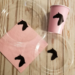 Horse plates from Partyof7Creations. It shows two clear plastic plates with the silhouette of a horse head in the center. There is also a pink napkin and cup with the same image. Horse plates from Partyof7Creations. It shows two clear plastic plates with the silhouette of a horse head in the center. There is also a pink napkin and cup with the same image.