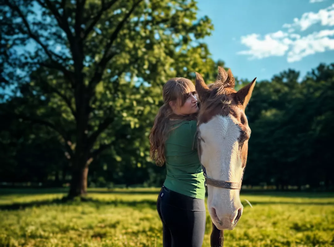 girl hugging a horse