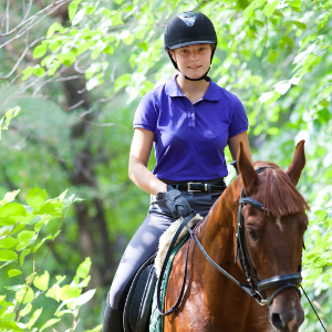 Girl riding a horse.