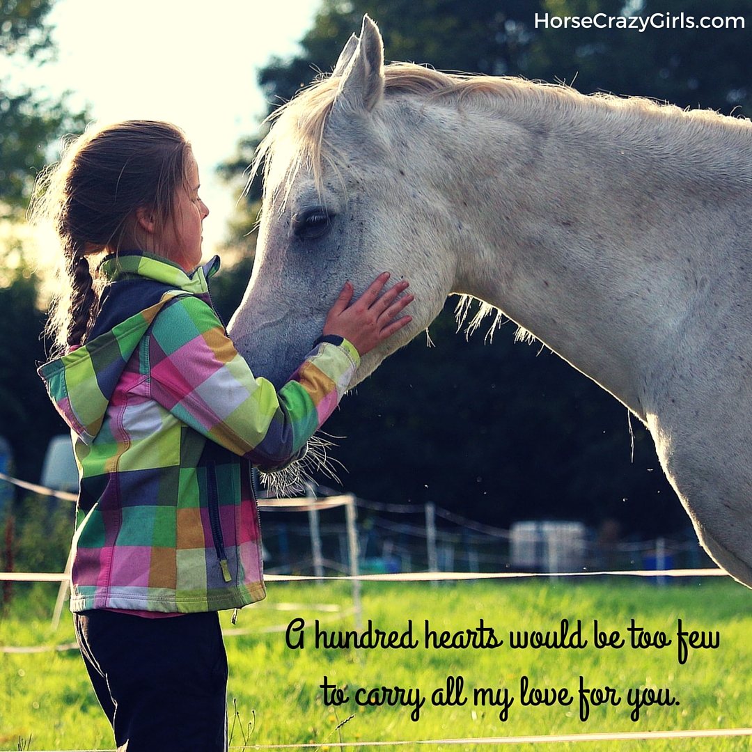 A young girl holding a horse's face between her hands with the quote "A hundred hearts would be too few to carry all my love for you" - Author Unknown